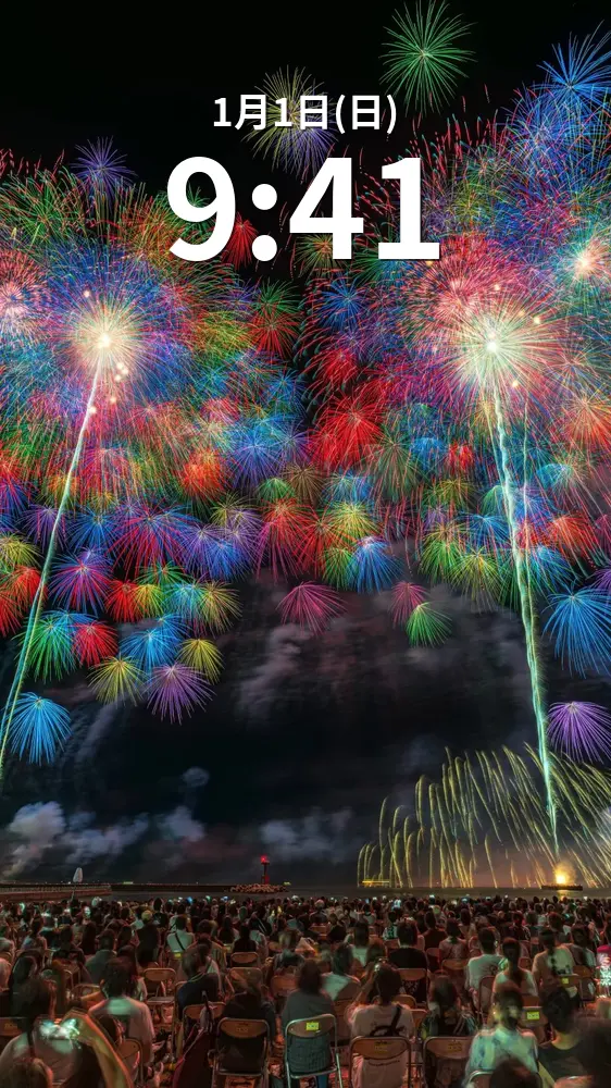 無料スマホ壁紙 2025年の彩色千輪菊（縦）。AndroidとiPhoneに対応した4K高画質の無料待ち受け画像。三重県鈴鹿市の鈴鹿げんき花火大会で撮影したフリー写真素材